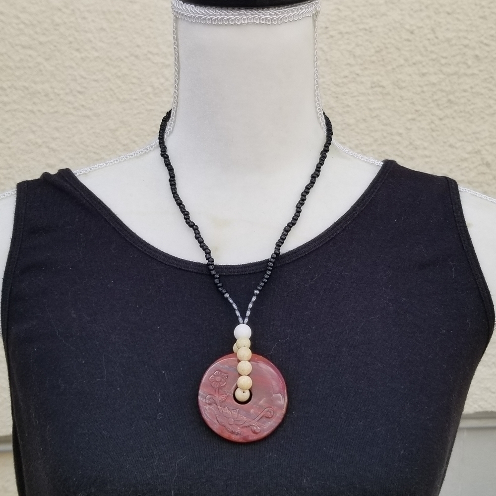 beaded necklace with large red floral agate pendant